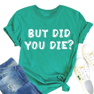 Dettaglio della t-shirt verde in cotone con scritta BUT DID YOU DIE e maniche con risvolto