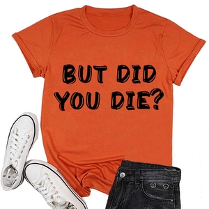 Flat lay di una t-shirt arancione girocollo con la scritta stampata 'BUT DID YOU DIE?'