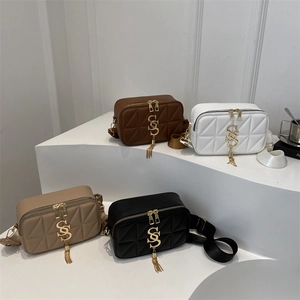 Quilted crossbody camera bags in four colors with gold S logo and chain tassels