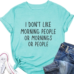 Detail of light blue crew neck T-shirt with black slogan print and knotted hem style