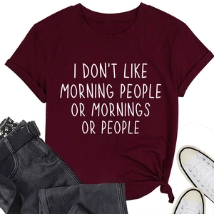 Detail of burgundy rolled-sleeve t-shirt featuring I Don't Like Morning People slogan