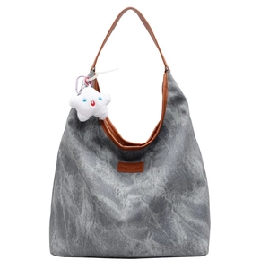 Chic gray acid wash canvas tote bag with brown leather straps and star plush charm