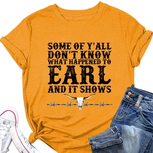 Detail of ginger yellow t-shirt with longhorn skull print and retro typography text