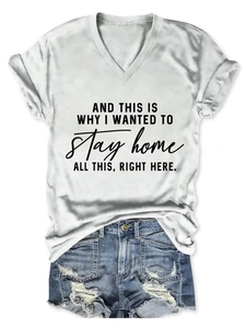 Flat lay of a white V-neck T-shirt with slogan and ripped denim shorts for summer style