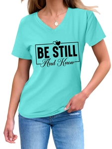 Detail of V-neck cotton T-shirt featuring Be Still And Know text print in bright teal