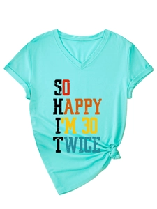 Detail of mint green V-neck T-shirt with 'So Happy I'm 30 Twice' vertical print