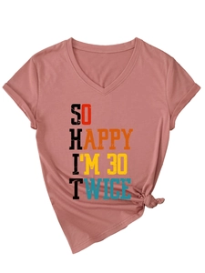 Detail of V-neck T-shirt with humorous 60th birthday quote and stylish knot hem design
