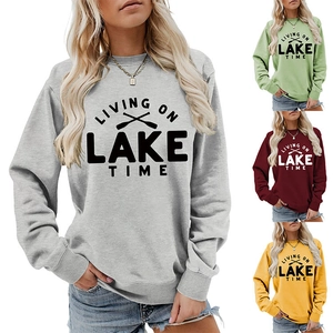 Detail of living on lake time women's crewneck sweatshirt with oars graphic and ribbed cuffs