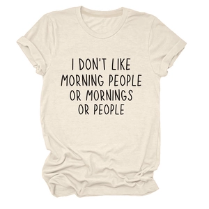 Detail of rolled sleeves and printed text on cream loose fit cotton t-shirt
