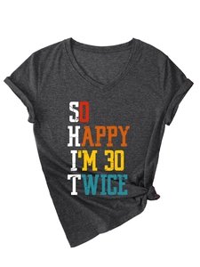 Detail of charcoal grey V-neck tee with rolled sleeves and a stylish knotted hem design
