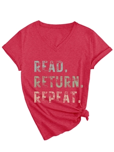 Detail of red V-neck T-shirt showing retro READ RETURN REPEAT print and knot detail