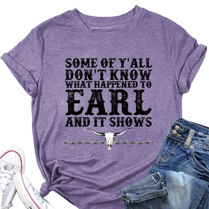 Flat lay of purple heathered t-shirt with vintage bull skull print and casual denim jeans