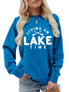 Blue sweatshirt detail featuring white Living On Lake Time graphic with oars design