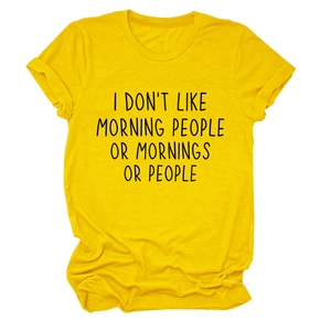 Detail of soft yellow cotton t-shirt featuring I DON'T LIKE MORNING slogan print