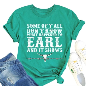 Detail of turquoise cotton t-shirt with cow skull graphic and vintage text print
