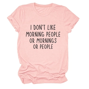 Detail of pink cotton T-shirt showing folded sleeves and black letter printed text