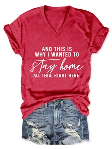 Detail of red V-neck T-shirt with white print and blue frayed hem denim shorts