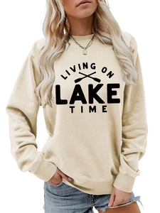 Detail of Living on Lake Time beige sweatshirt featuring ribbed cuffs and soft cotton texture