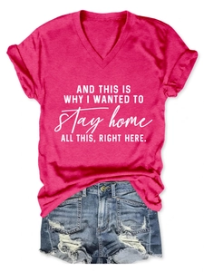 Detail of rose red V-neck T-shirt with white text and distressed denim shorts set