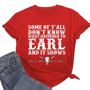 Macro shot of red cotton T-shirt featuring bull skull print and vintage typography detail