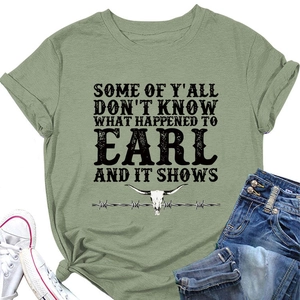 Flat lay of sage green crew neck T-shirt with longhorn skull print and denim jeans