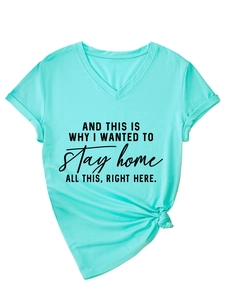Detail of mint green V-neck T-shirt with black text print and stylish knotted hem design