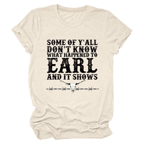 Detail of western style t-shirt featuring bull skull graphic and slogan on cream fabric