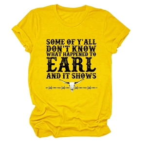 Detail of the yellow cotton t-shirt with a vintage bull skull and bold slogan print