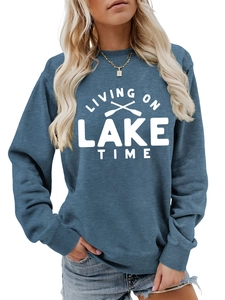 Detail of living on lake time print on grey-blue sweatshirt with ribbed cuffs and hem