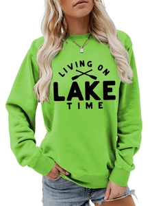 Close-up of Living On Lake Time graphic sweatshirt with ribbed neckline and fabric detail
