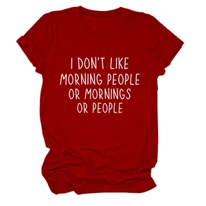 Detail of red crew neck t-shirt featuring I DON'T LIKE MORNING PEOPLE white slogan print