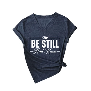Women's V-neck T-shirt with 'BE STILL' quote print and knotted hem in navy blue