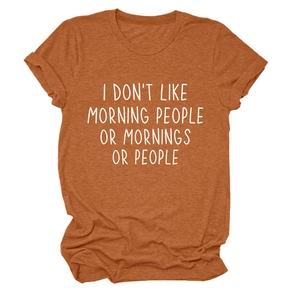 Detail of rolled cuffs and white humor text print on rusty orange crewneck T-shirt