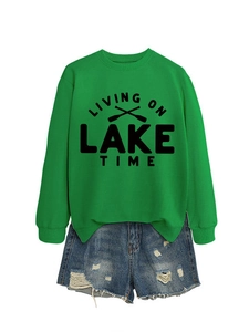 Green Living on Lake Time sweatshirt paired with distressed blue denim shorts