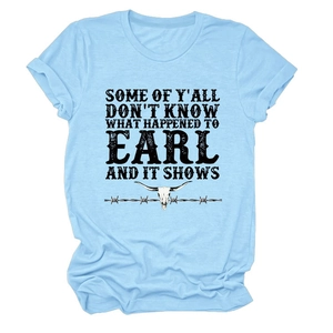 Detail of light blue t-shirt with roll-up sleeves and vintage bull skull graphic print