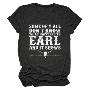 Close-up of charcoal grey t-shirt featuring white bull skull graphic and vintage text