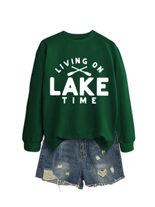 Detail view of cotton sweatshirt with Living On Lake Time print and frayed denim shorts