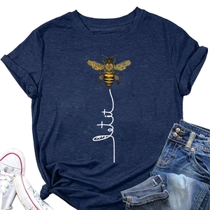 Close-up of navy blue T-shirt with bee print and Let it be script on fabric