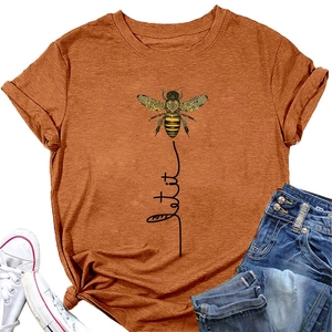 Flat lay of burnt orange cotton t-shirt featuring bee graphic and let it be text detail