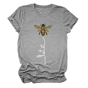 Close-up of grey t-shirt featuring a yellow bee print and let it be cursive text detail
