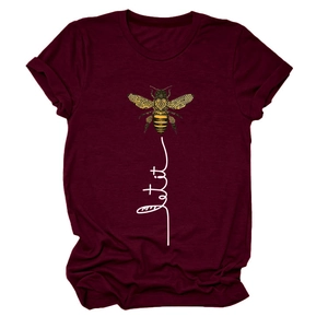 Detail of bee graphic and handwritten let it text on burgundy cotton t-shirt