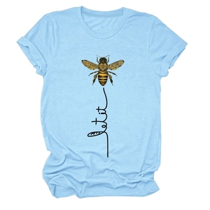 Detail of light blue cotton T-shirt featuring artistic bee print and let it be text