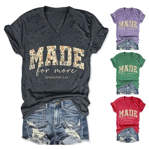 Detail of four colorful V-neck t-shirts featuring Made for More floral print typography