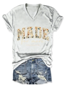 Detail of V-neck white T-shirt with floral Made for More print and frayed denim shorts