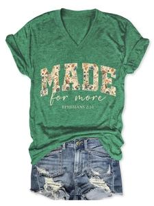 Detail of V-neck T-shirt with floral Made for More print and distressed denim shorts