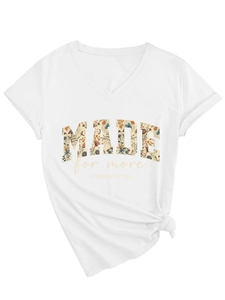 Detail of V-neck white T-shirt with floral print text and stylish side knot design