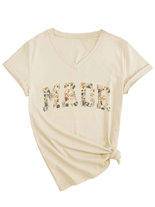 Detail of V-neck T-shirt with 'MADE for more' floral text and side knot hem design