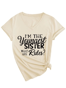 Detail of beige V-neck T-shirt with I'M THE Youngest SISTER print and knotted hem
