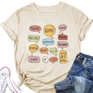 Detail of beige teacher t-shirt featuring multilingual kumu and maestra typography