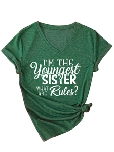 Detail of dark green V-neck T-shirt with white Youngest Sister text and rolled sleeves